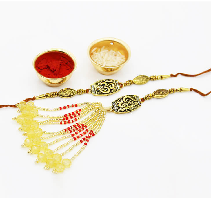 Buy OM Designer Golden Jewelry Pair Rakhi