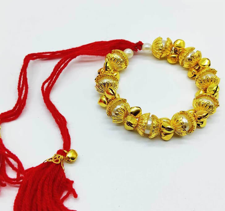 Buy Golden Charming Bracelet Kada Rakhi