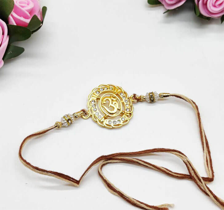 Buy Designer OM Diamond Stone Center Piece Bhaiya Rakhi