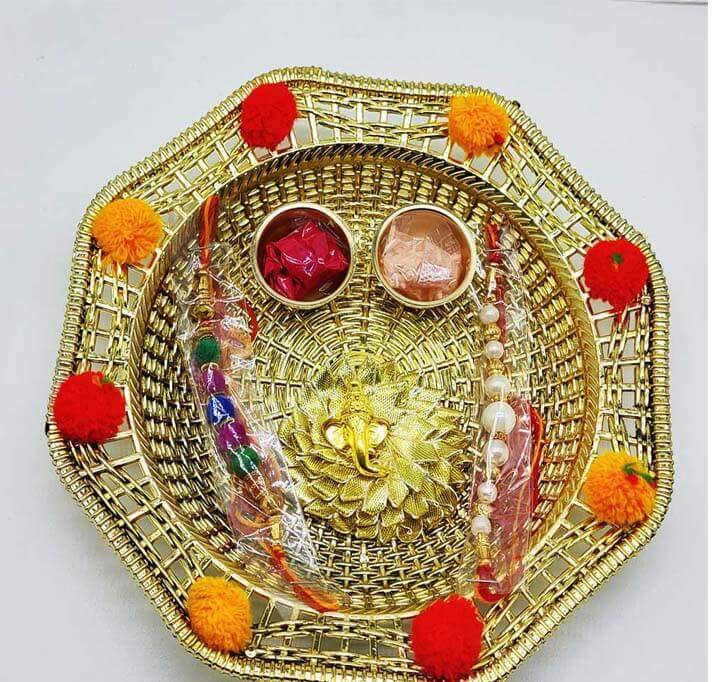 Buy Floral Decorative Golden Pooja Thali With White Beaded Rakhi