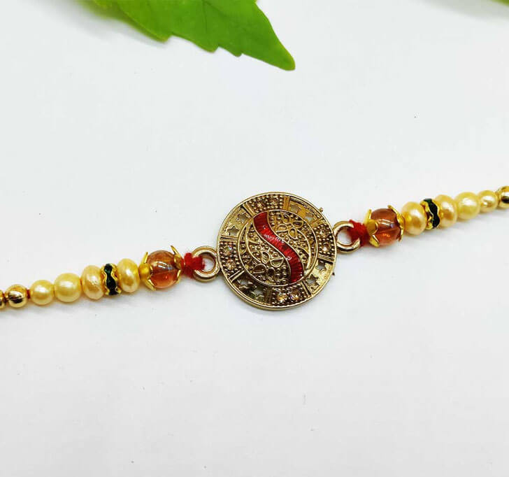 Buy Golden Traditional Center Piece Bhaiya Rakhi