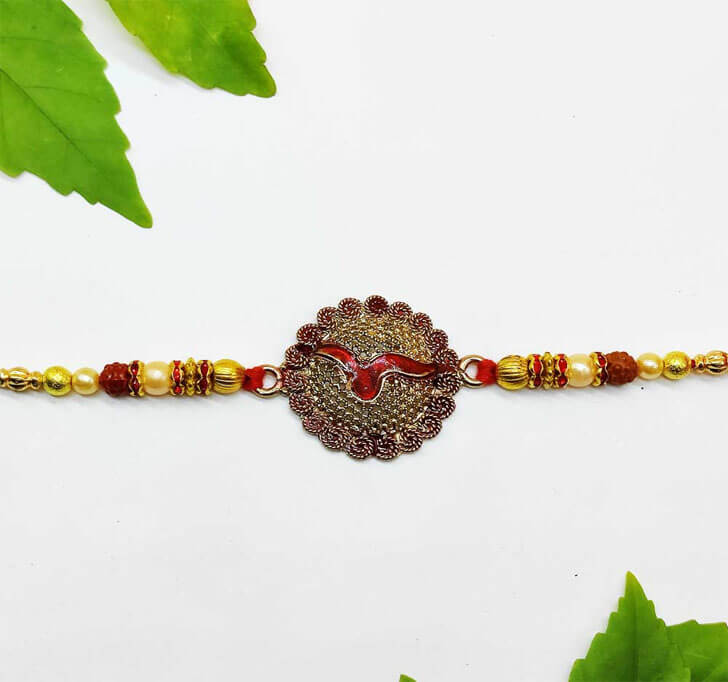 Buy Traditional Designer Golden Center Piece Bhaiya Rakhi