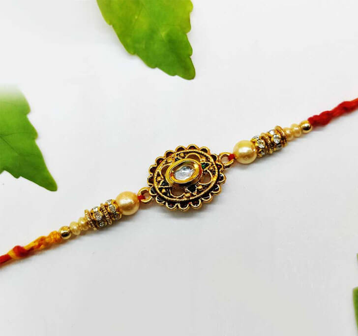 Buy Golden Designer Diamond Stone Center Piece Bhaiya Rakhi