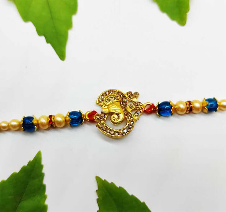 Buy Elephant OM Golden Designer Center Piece Bhaiya Rakhi