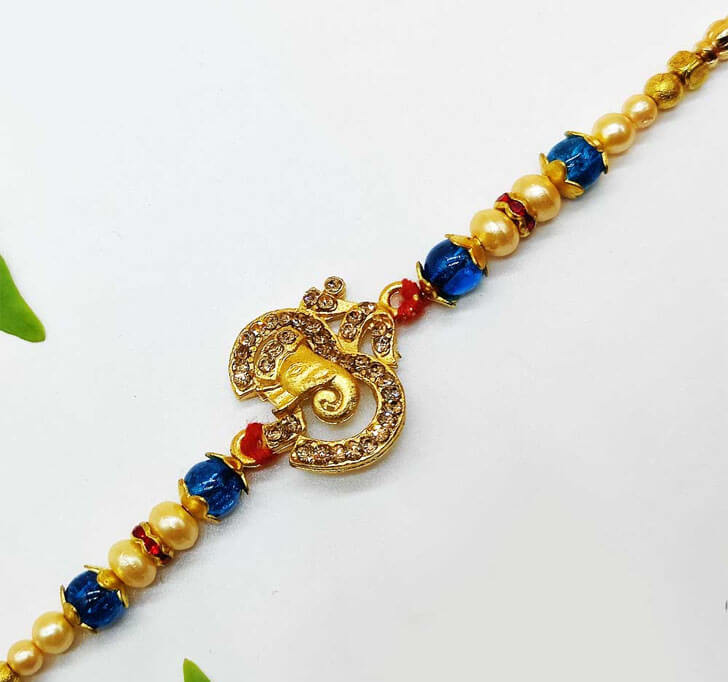 Buy Elephant OM Golden Designer Center Piece Bhaiya Rakhi