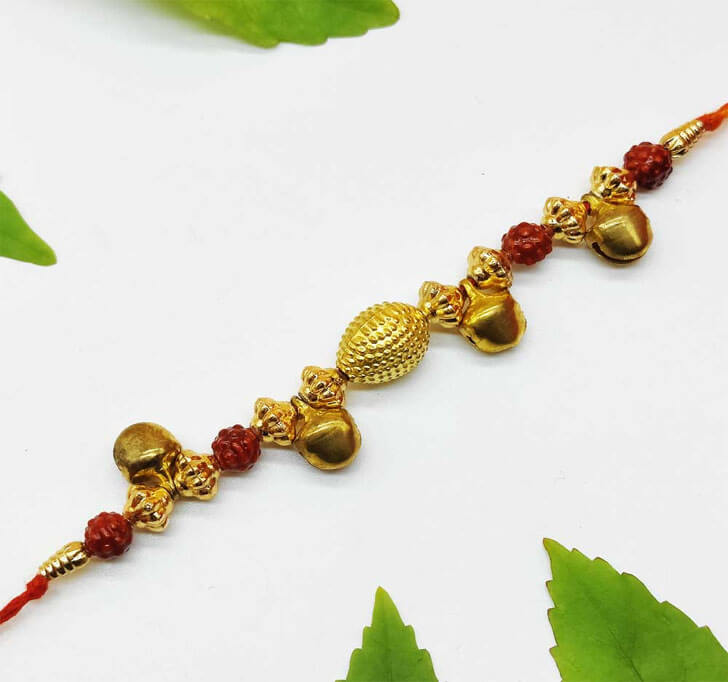 Buy Golden Ghungru Designer Center Piece Bhaiya Rakhi