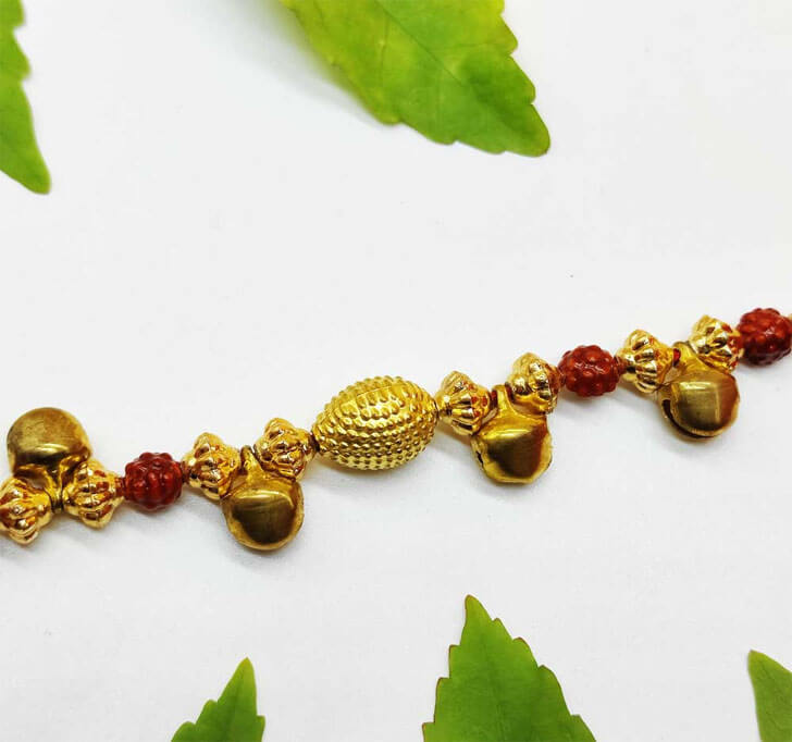Buy Golden Ghungru Designer Center Piece Bhaiya Rakhi