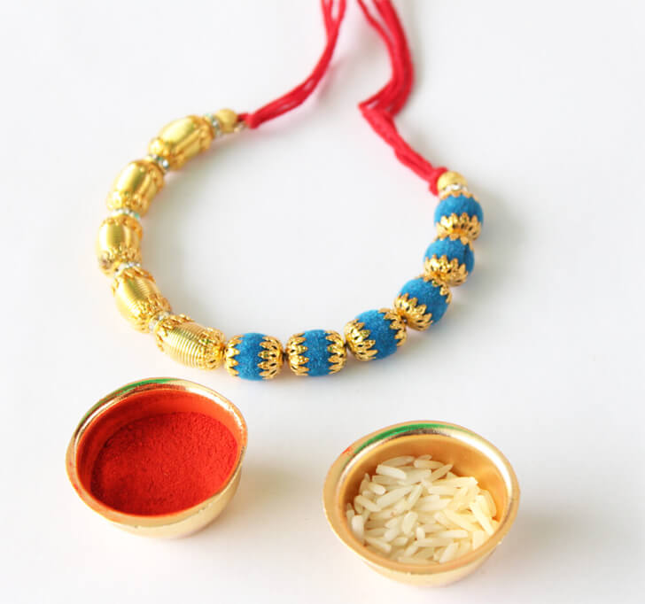 Buy Blue Gold Finish Kada Rakhi