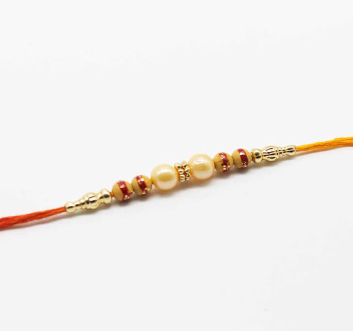 Buy Cream Pearl Fancy Dora Bhaiya Rakhi