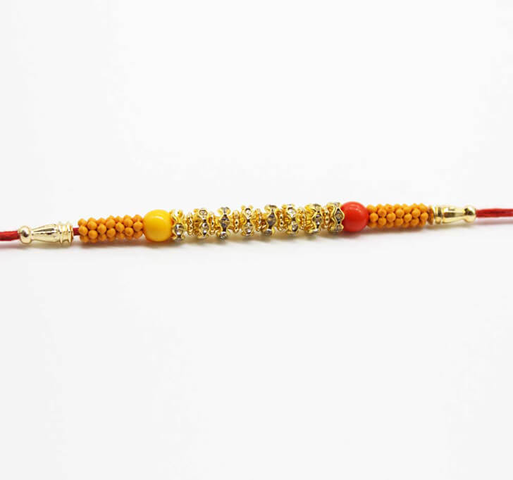 Buy Golden White Diamond Dora Bhaiya Rakhi