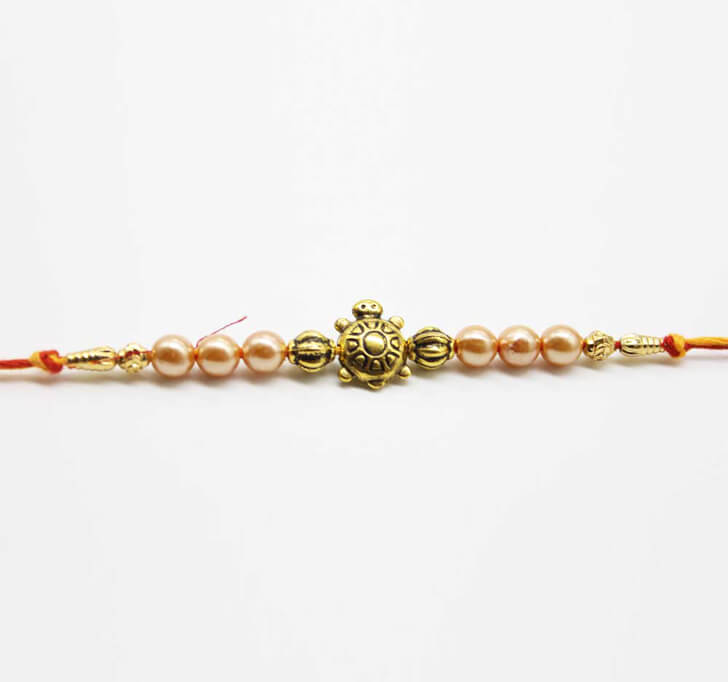 Buy Tortoise Center Piece Dora Bhaiya Rakhi
