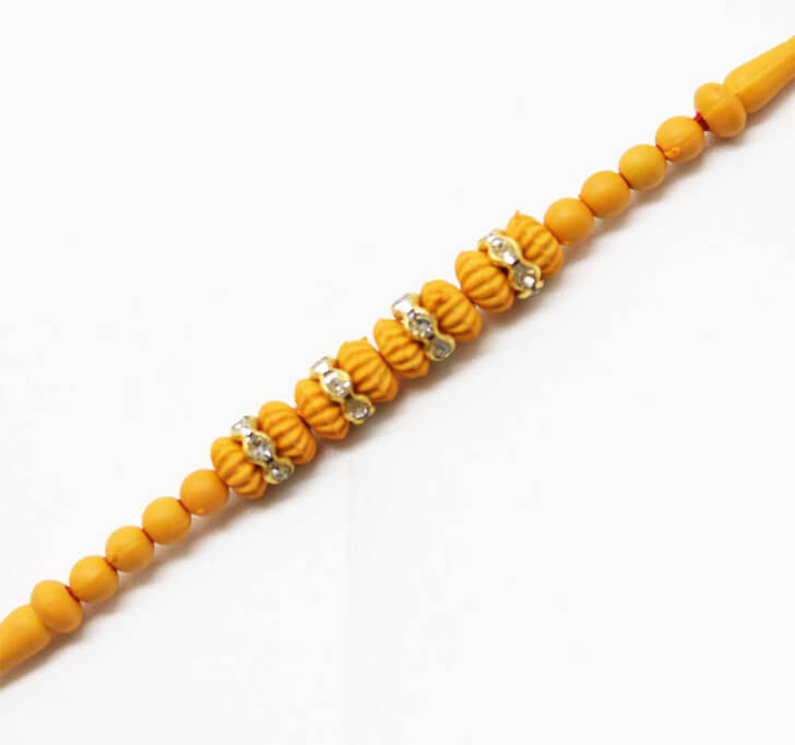 Buy Designer Yellow White Beads Dora Bhaiya Rakhi